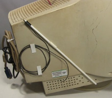 The high voltage discharge stick in its holder on the side
      of the PC monitor high voltage power supply case.