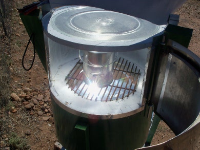 Looking through the open door into Art's hybrid solar oven.