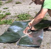 Putting in the last reflector of the Copenhagen solar cooker.