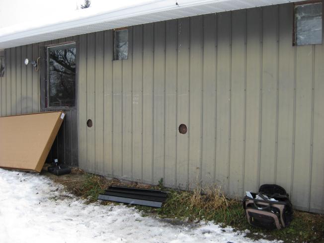 The two holes drilled for the solarsheat, seen from the outside.