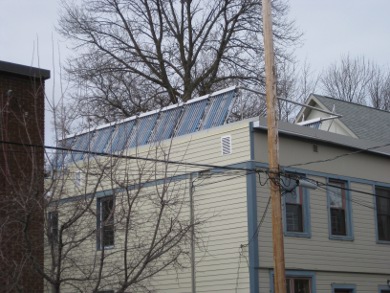 Large evacuated tube solar heating system for a group of people.