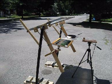 Fresnel lens solar cooker with mirror.