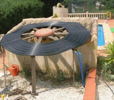 Flat spiral solar heater system.