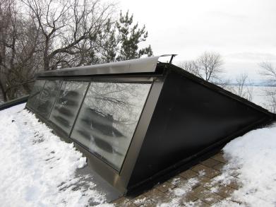 Front/side view showing the path of the air down to the front of the SolarSheat solar air heaters..