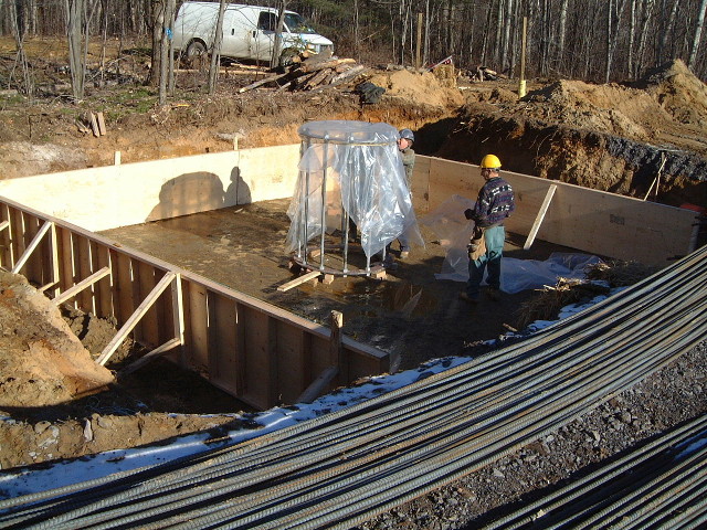 The wooden form and metal column for the wind turbine.