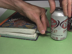 Drawing a line around the cans near the bottom for the alcohol stove.