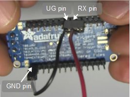 Pins for putting the Adafruit Audio FX Sound Board into UART 
      mode, including the UG, RX and a GND pin, bottom view.