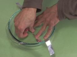 2. Tape the long strip into the bowl for the ball cyclotron/
      electrostatic accelerator.