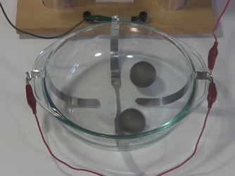 The ball cyclotron/electrostatic accelerator not running so that
      you can see the balls clearly.