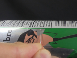 Another view of pulling the needle tangentially to the curvature of the soda can.