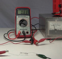 Electric current heating the nitinol wire shape memory allor,
      making it go back to its memorized coil shape.