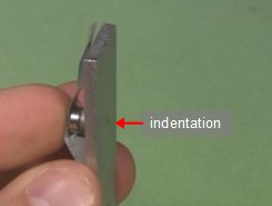 Step 3b. Taping magnets to the other part of the sunflower heat engine.