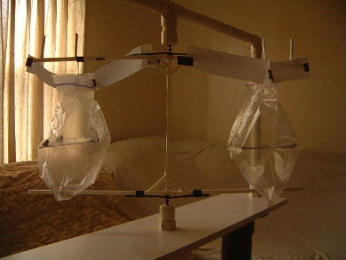 Poynting flow thruster test with paper strips redirecting
      ionized airflow from bare wires.